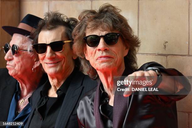 Keith Richards, Ron Wood and Mick Jagger of legendary British rock band, The Rolling Stones pose as they arrive to attend a launch event for their...