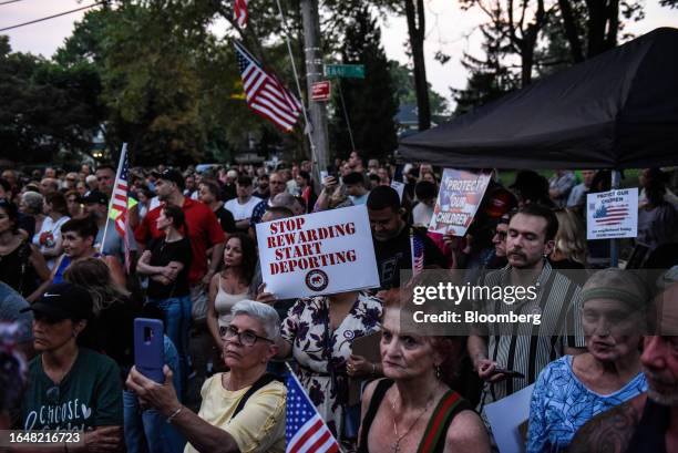 Demonstrators at a rally protesting the opening of a temporary shelter for asylum seekers in the Staten Island borough of New York, US, on Tuesday,...