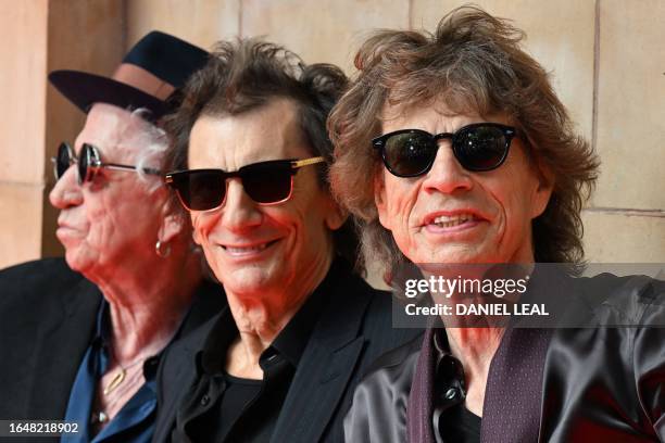 Keith Richards, Ron Wood and Mick Jagger of legendary British rock band, The Rolling Stones pose as they arrive to attend a launch event for their...