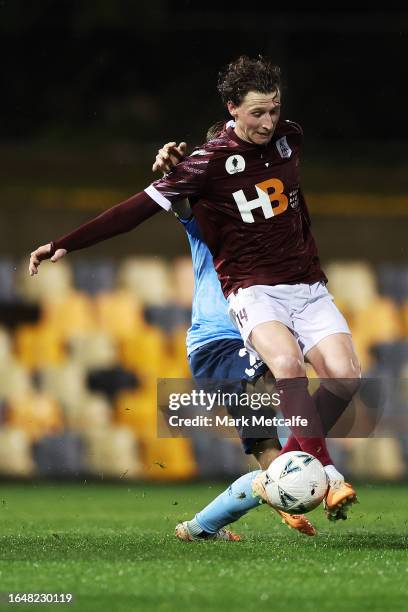 Jack Armson of Leichhardt FC is challenged by Luke Brattan of Sydney FC during the Australia Cup 2023 Round of 16 match between APIA Leichhardt FC...