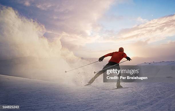 a cross country skier at sunset in norway - esquíes de fondo fotografías e imágenes de stock