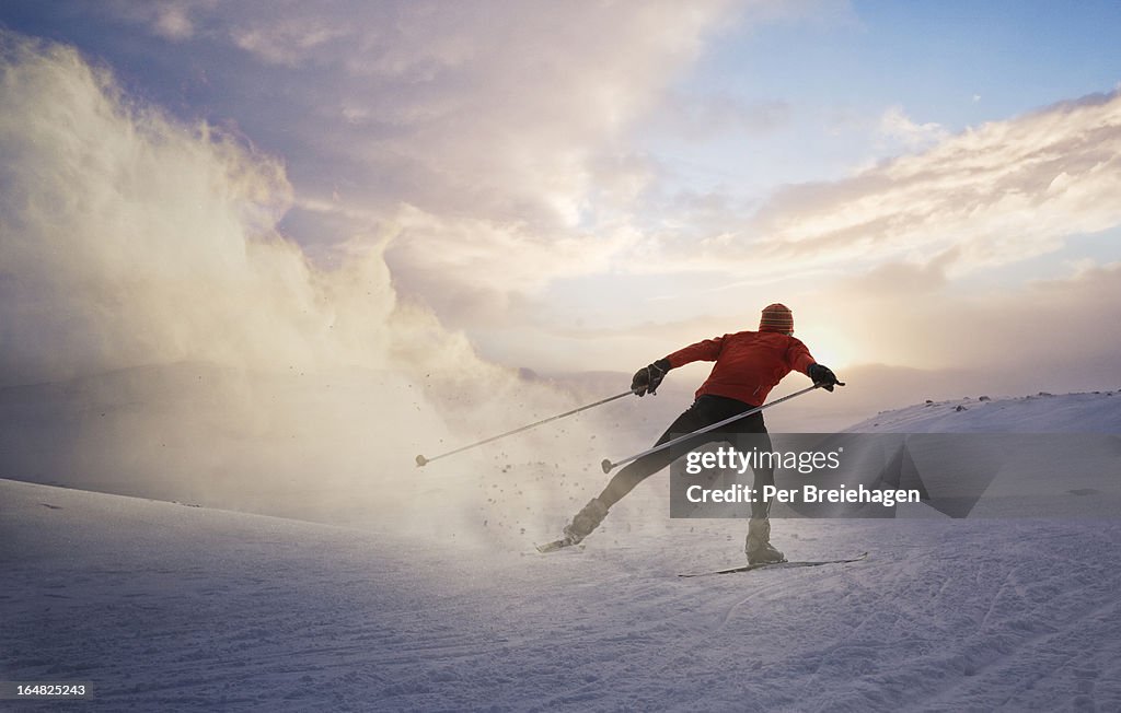 A cross country skier at sunset in Norway