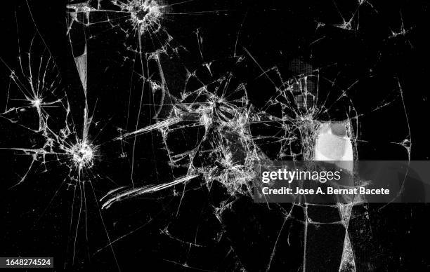 full frame of a screen of a smartphone with broken glass. - cracked mirror stock pictures, royalty-free photos & images