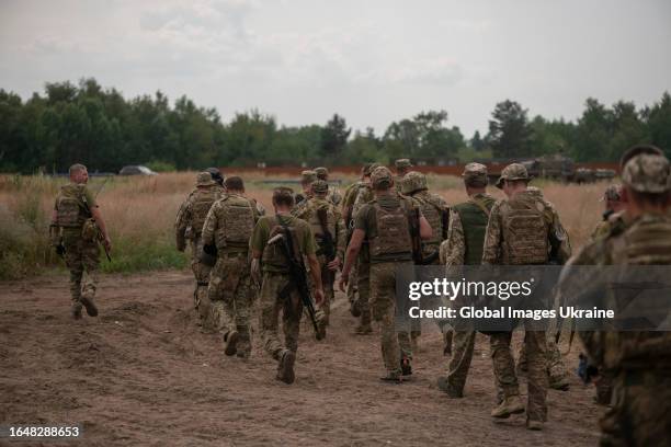 Ukrainian military go to training ground during exercises on July 3, 2023 in Donetsk Oblast, Ukraine. Mobilization of the Ukrainian army continues in...