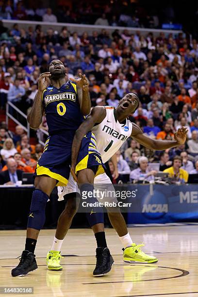 Jamil Wilson of the Marquette Golden Eagles fights for position against Durand Scott of the Miami Hurricanes during the East Regional Round of the...
