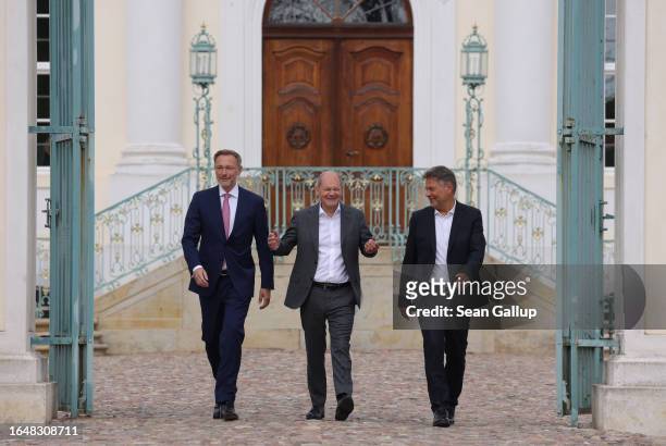 German Chancellor Olaf Scholz , Economy and Climate Action Minister Robert Habeck and Finance Minister Christian Lindner arrive to address the media...