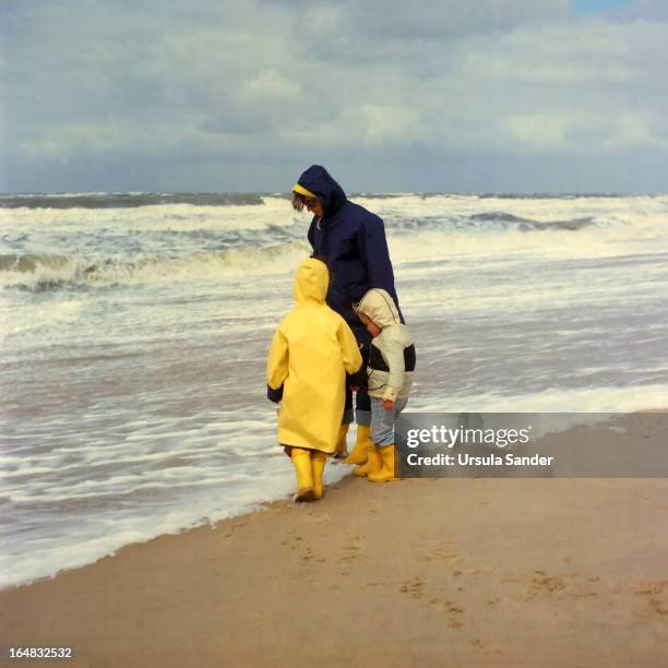 mother with her children on beach - 1980 stock pictures, royalty-free photos & images