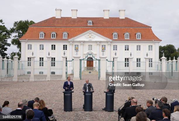 German Chancellor Olaf Scholz , Economy and Climate Action Minister Robert Habeck and Finance Minister Christian Lindner address the media at the...