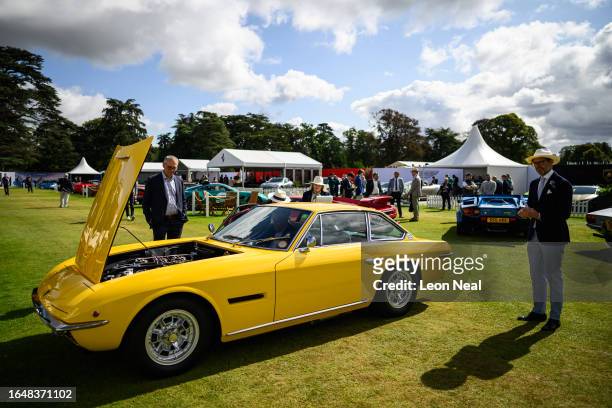 Judges inspect a 1969 Lamborghini Islero S by Touring ahead of the awards parade during the Salon Prive classic car event at Blenheim Palace on...