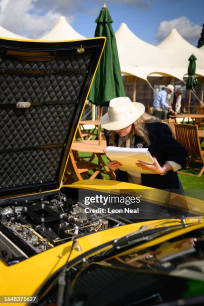 Judges inspect a 1969 Lamborghini Islero S by Touring ahead of the awards parade during the Salon Prive classic car event at Blenheim Palace on...