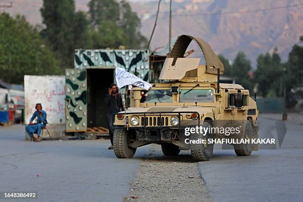Humvee vehicle is seen near the closed gates of Torkham border crossing between Afghanistan and Pakistan in Afghanistan's eastern Nangarhar province...