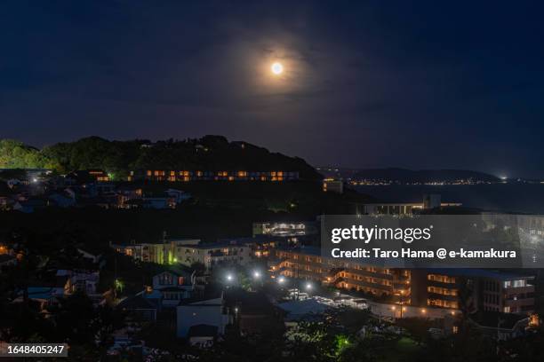 super full moon over the residential district by the sea in kanagawa of japan - shizuoka prefecture stock pictures, royalty-free photos & images