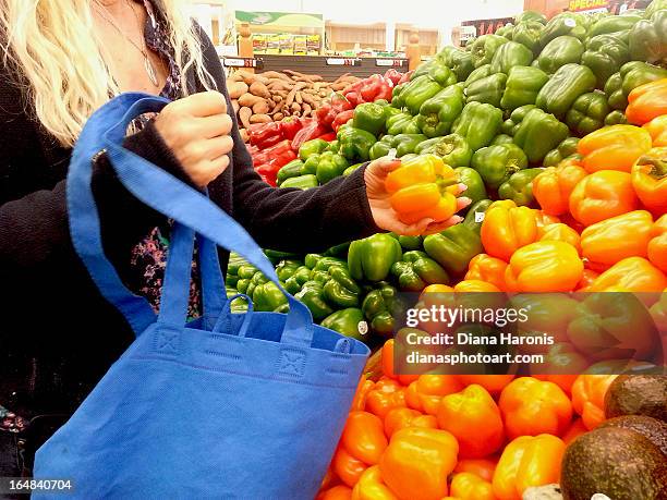 woman buying peppers - huntington beach market stock-fotos und bilder