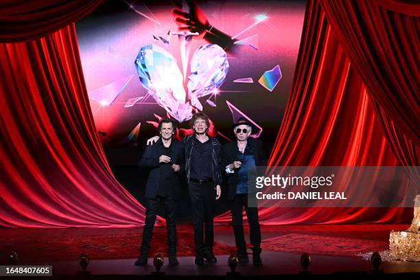 Ron Wood, Mick Jagger and Keith Richards of legendary British rock band, The Rolling Stones pose on stage during a launch event for their new album,...
