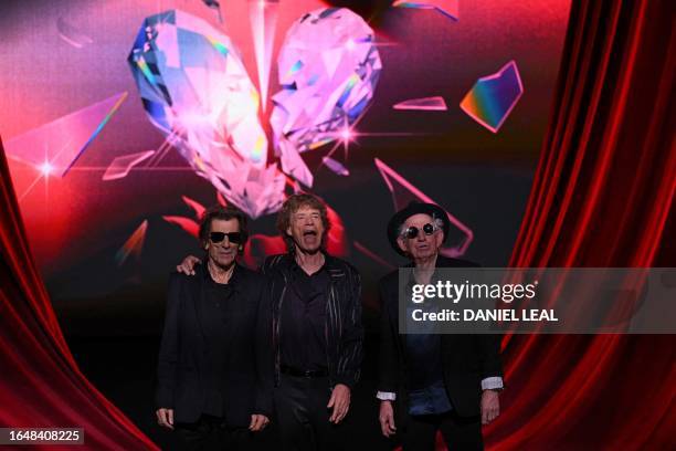 Ron Wood, Mick Jagger and Keith Richards of legendary British rock band, The Rolling Stones pose on stage during a launch event for their new album,...