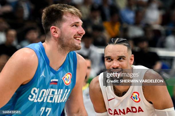 Canada's Dillon Brooks and Slovenia's Luka Doncic react during the FIBA Basketball World Cup quarter-final match between Canada and Slovenia at the...