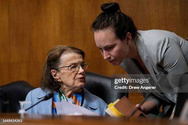 Sen. Dianne Feinstein speaks with an aide during a Senate Judiciary Committee hearing on judicial nominations on Capitol Hill September 6, 2023 in...