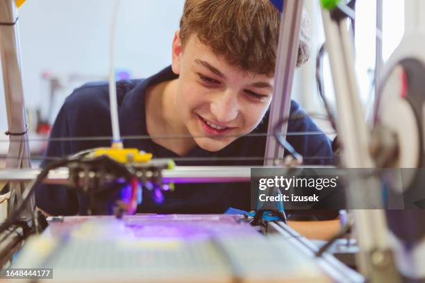 high school student watching 3d print - school students science stock pictures, royalty-free photos & images