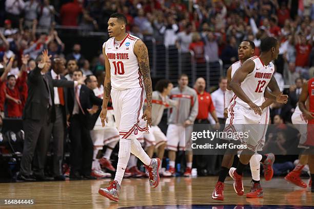 LaQuinton Ross of the Ohio State Buckeyes reacts after he hits a three-pointer in the final second against the Arizona Wildcats during the West...