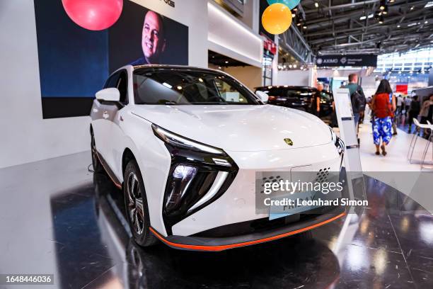 Visitors look at a Friday electric car of Chinese car marque Forthing, owned by the Chinese automaker Dongfeng Liuzhou Motor, at the IAA Mobility...