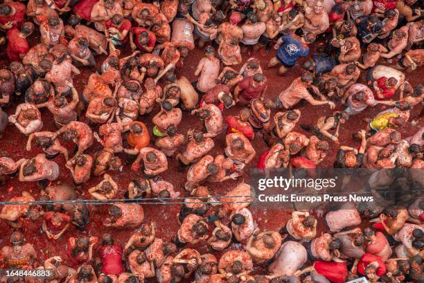 Several people participate in the festival of La Tomatina, on 30 August, 2023 in Buñol, Valencia, Valencian Community, Spain. La Tomatina has been...