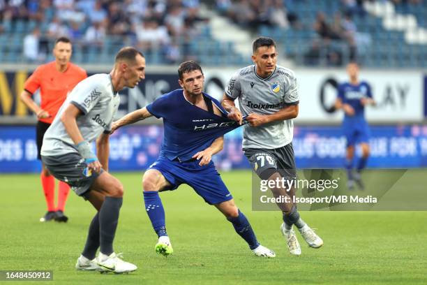 Hugo Cuypers of AA Gent battles for the ball with Georgi Kostadinov of Apoel during the qualifying game/ Play Off between Kaa Gent and FC Apoel in...