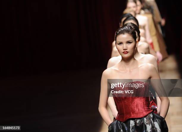 Models showcase designs on the catwalk during the Asahi Kasei Creativity Award Wang Yutao collection show on the fifth day of Mercedes-Benz China...