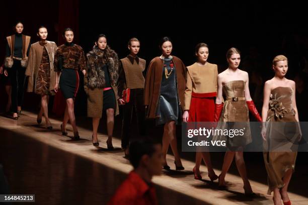 Models showcase designs on the catwalk during the Asahi Kasei Creativity Award Wang Yutao collection show on the fifth day of Mercedes-Benz China...