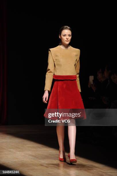 Model showcases designs on the catwalk during the Asahi Kasei Creativity Award Wang Yutao collection show on the fifth day of Mercedes-Benz China...