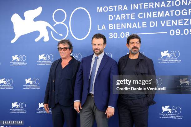 Sandro Veronesi, Director Edoardo De Angelis and Pierfrancesco Favino attend a photocall for the movie "Comandante" at the 80th Venice International...