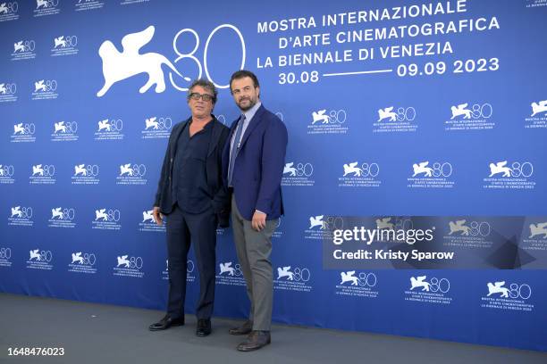 Sandro Veronesi and Director Edoardo De Angelis attend a photocall for the movie "Comandante" at the 80th Venice International Film Festival on...