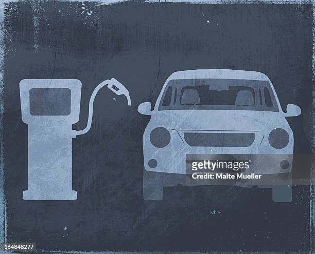 a stencil of a car next to a fuel pump - side by side stock illustrations