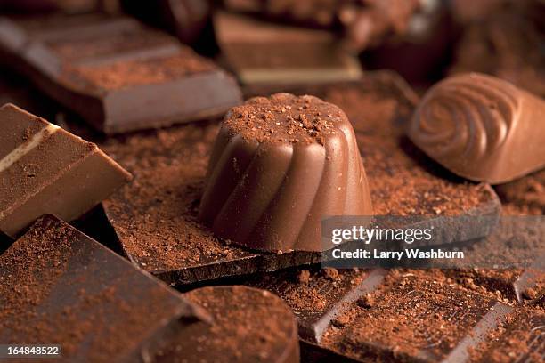 detail of a pile of chocolates - cocoa powder stock pictures, royalty-free photos & images