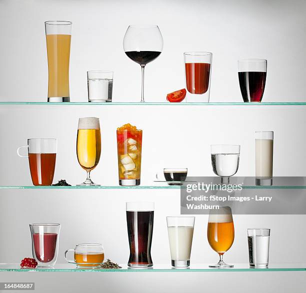 a collection of various types of drinking glasses filled with a variety of beverages - coffee drink stock-fotos und bilder