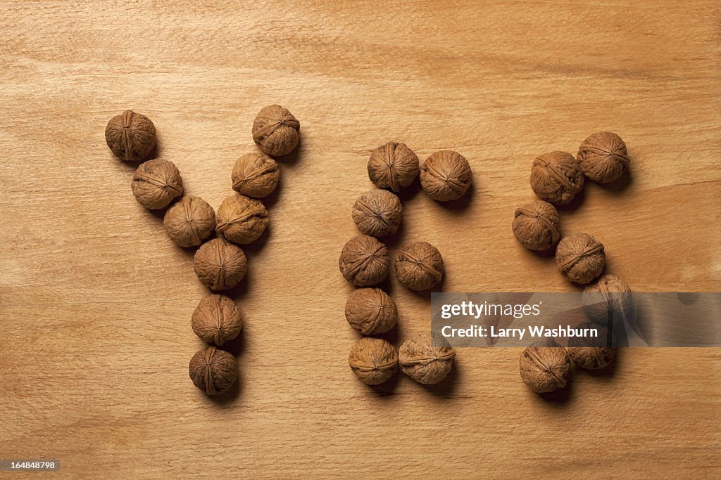 Single word 'yes' spelled with walnuts