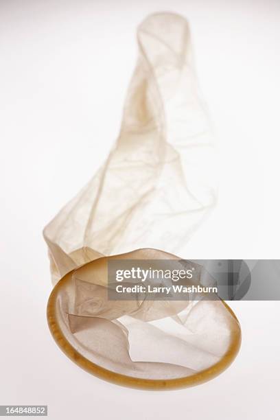 an empty used condom - used condoms stock pictures, royalty-free photos & images