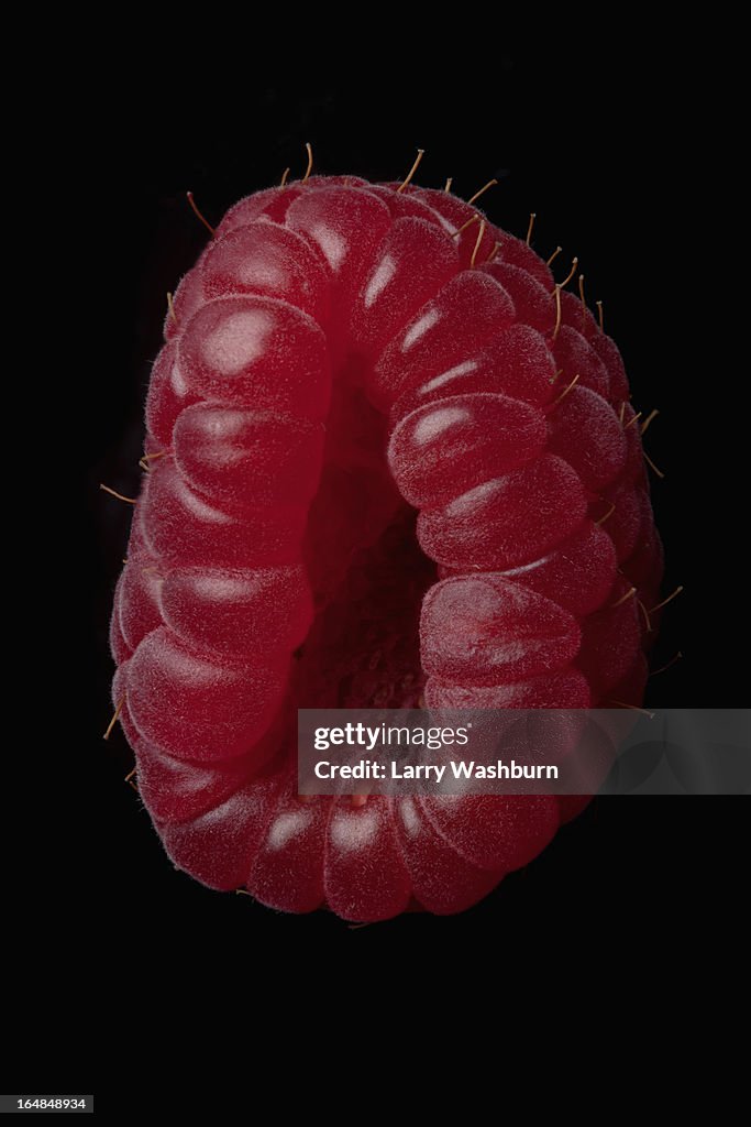 A raspberry arranged suggestively