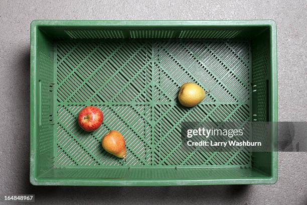 three pieces of fruit in a plastic shopping basket - convenience basket stock pictures, royalty-free photos & images