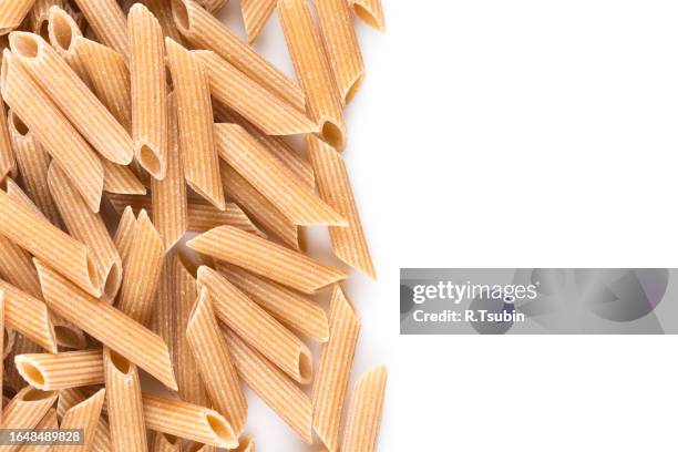 wholegrain penne pasta - vollkorn stock pictures, royalty-free photos & images