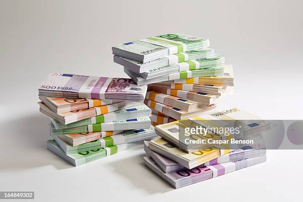 stacks of large billed euro banknotes - nota de euro da união europeia imagens e fotografias de stock