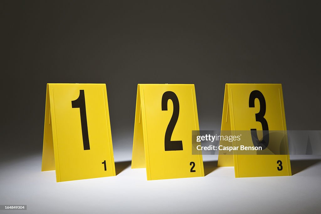 Three evidence markers arranged in a row in numerical order