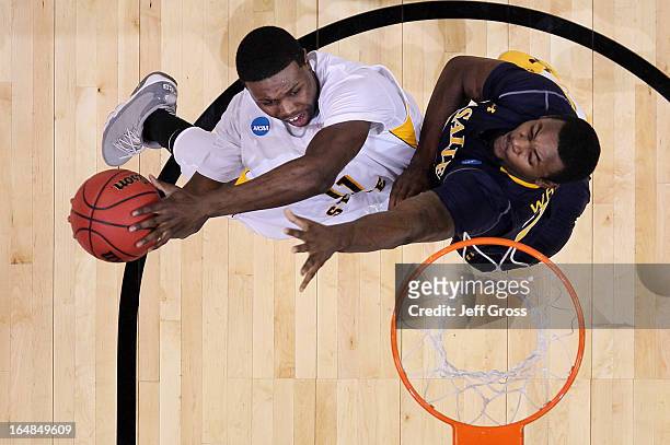 Cleanthony Early of the Wichita State Shockers goes up for a shot against Jerrell Wright of the La Salle Explorers in the first half during the West...