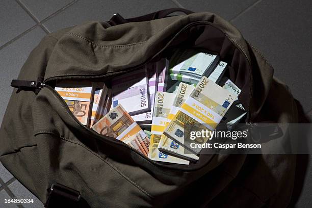 a bag full of large billed euro banknotes - money floor stock pictures, royalty-free photos & images