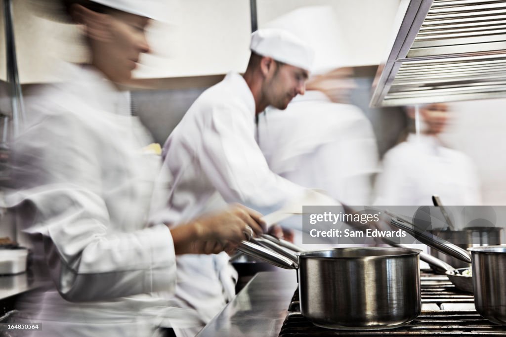 Chefs cooking in restaurant kitchen