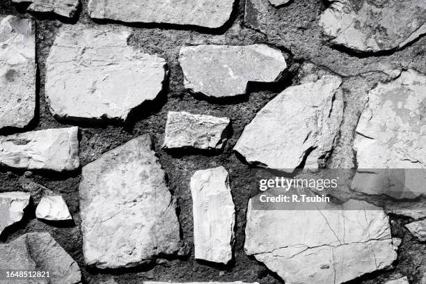 wall of stones as a texture - muro fortificado imagens e fotografias de stock