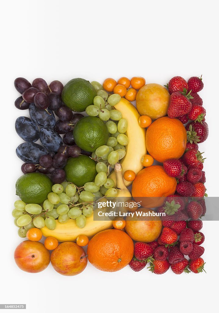 Various fresh fruits arranged into the shape of square