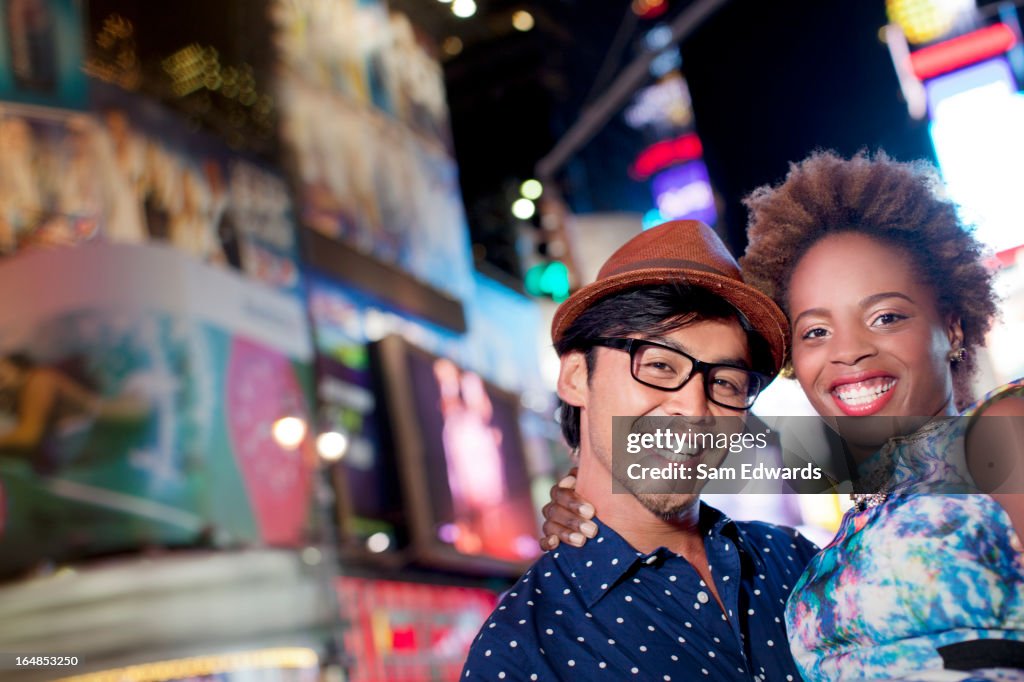 Couple smiling together on city street