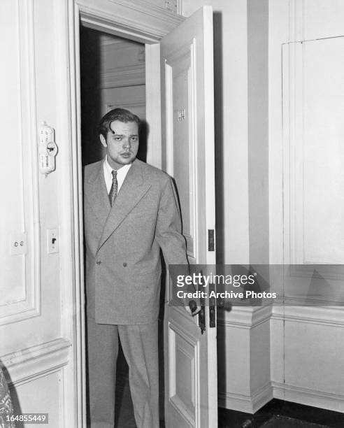 American actor, writer, director and producer Orson Welles meets the press the morning after his dramatic radio broadcast 'The War of the Worlds',...