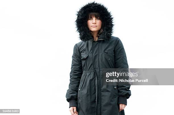 woman in fur lined coat - winter jacket stock pictures, royalty-free photos & images