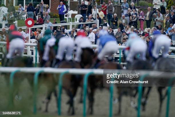 The crowd look on as runners pass the grandstands during The Racing League On Sky Sports Racing Amateur Jockeys' Handicap at Lingfield Park...